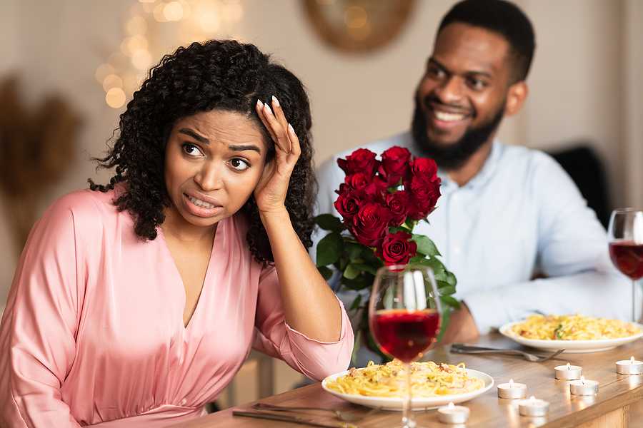 Online Dating Cheerful Couple in a Restaurant